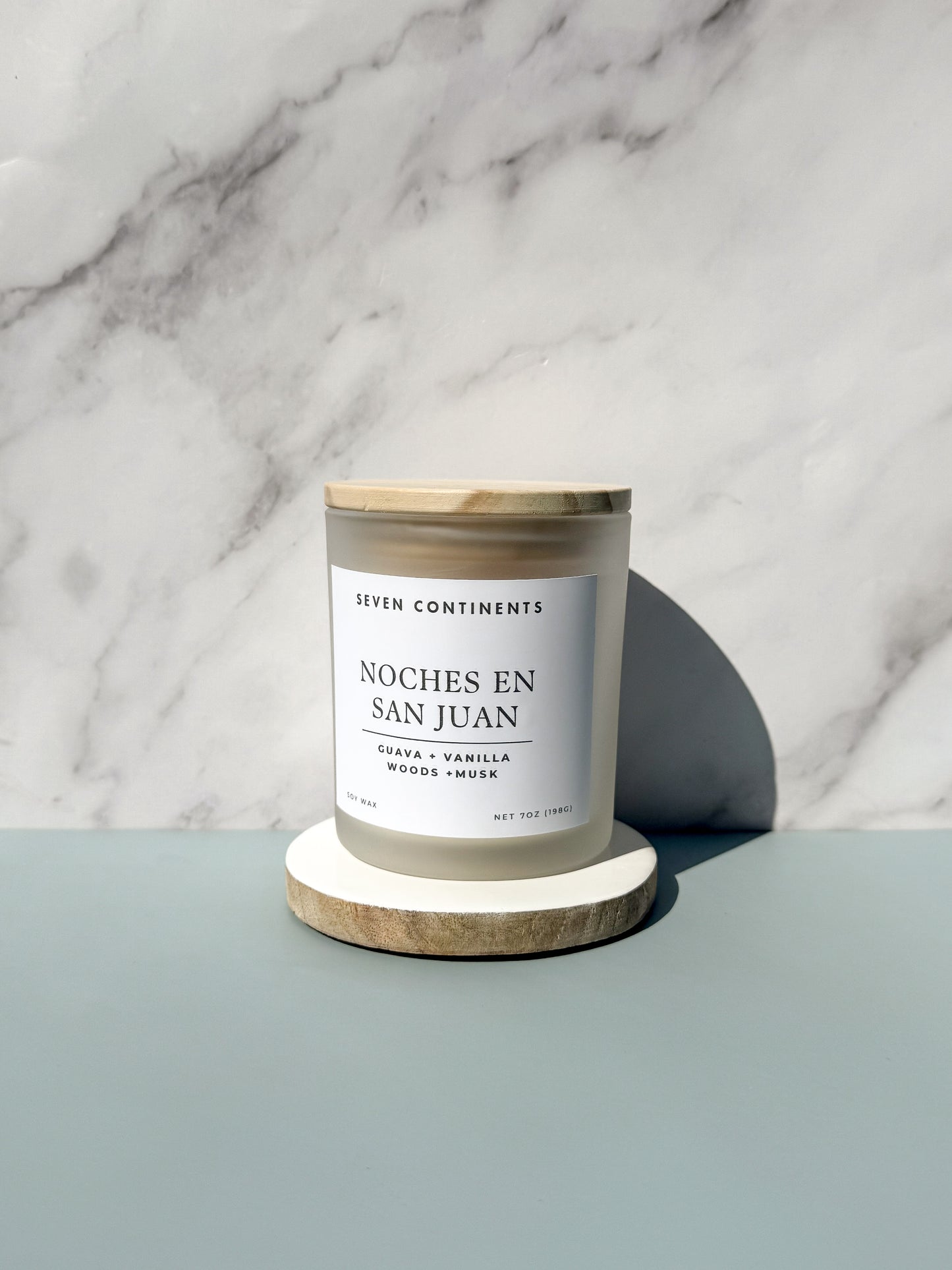 Noches en San Juan candle styled with warm tropical decor and evening lighting
