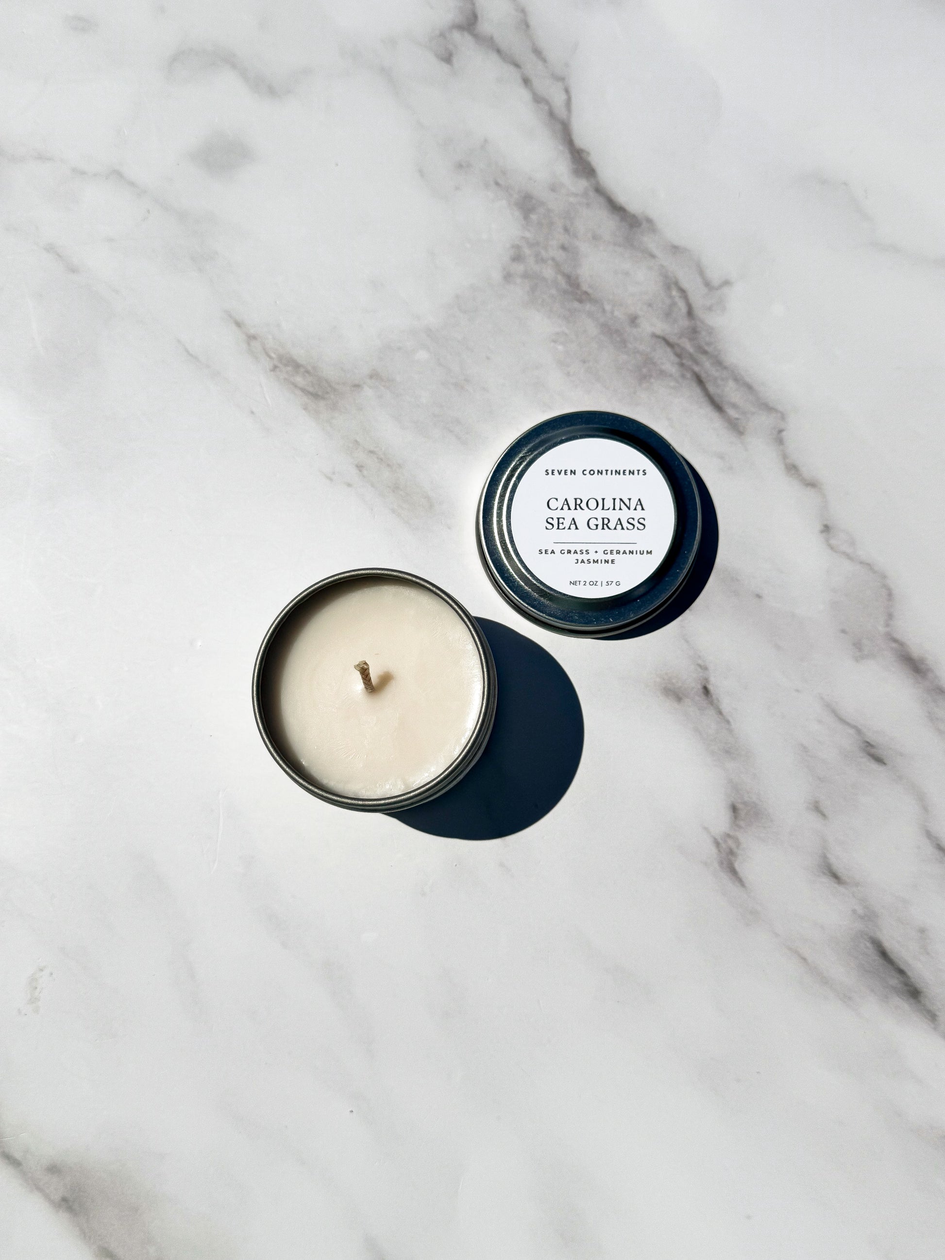 Mini Carolina Sea Grass travel 
candle with fresh sea grass and floral fragrance