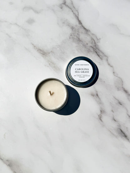 Mini Carolina Sea Grass travel 
candle with fresh sea grass and floral fragrance