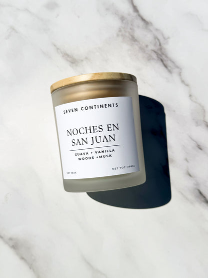 Close-up of Noches en San Juan candle label with guava, vanilla, woods, and musk scent notes
