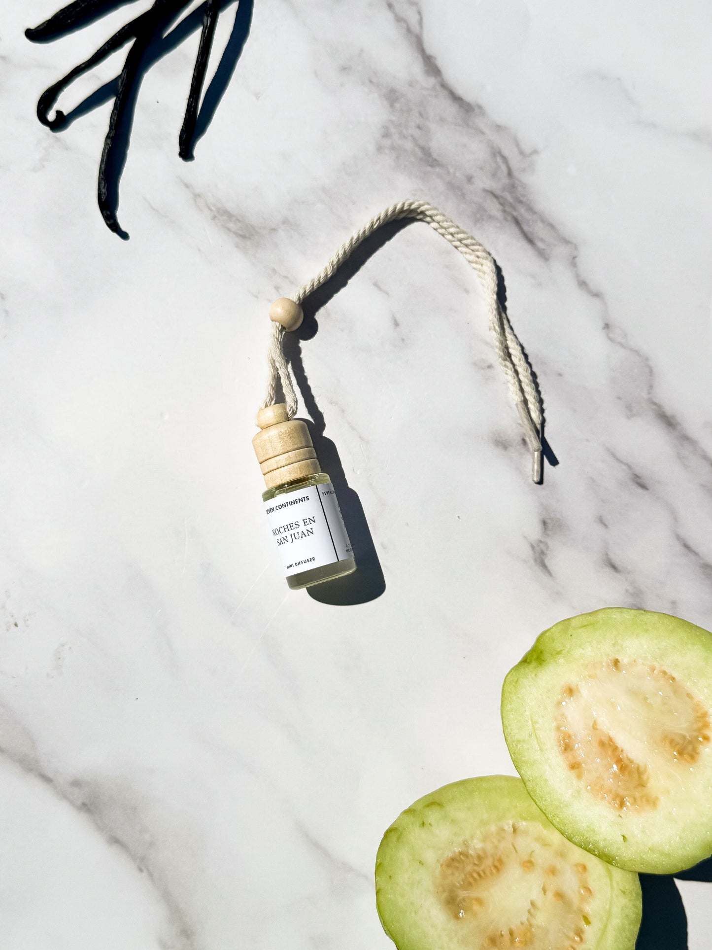 Noches en San Juan car diffuser with guava, vanilla, woods, and musk fragrance
