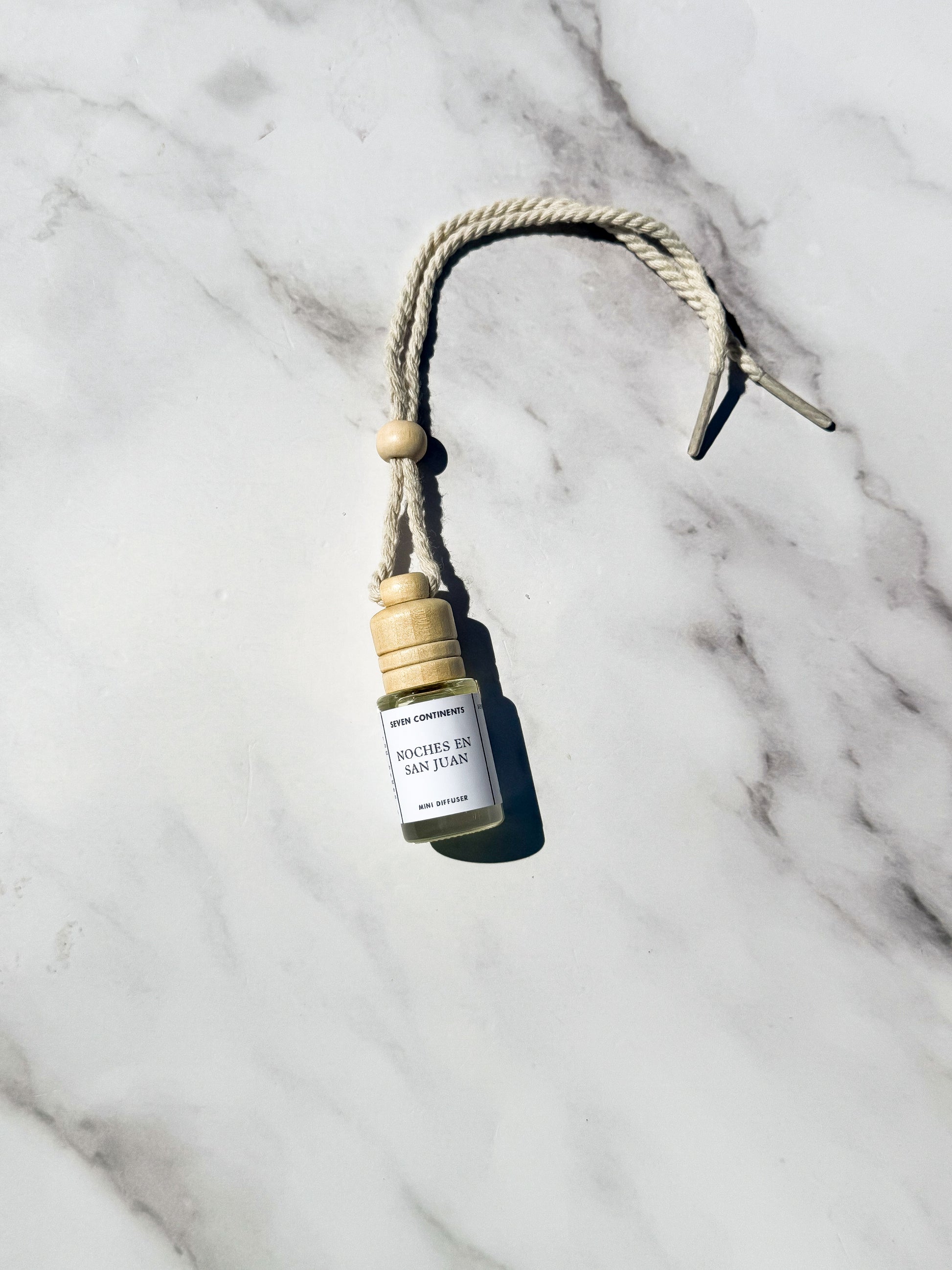 Noches en San Juan car diffuser with guava, vanilla, woods, and musk fragrance