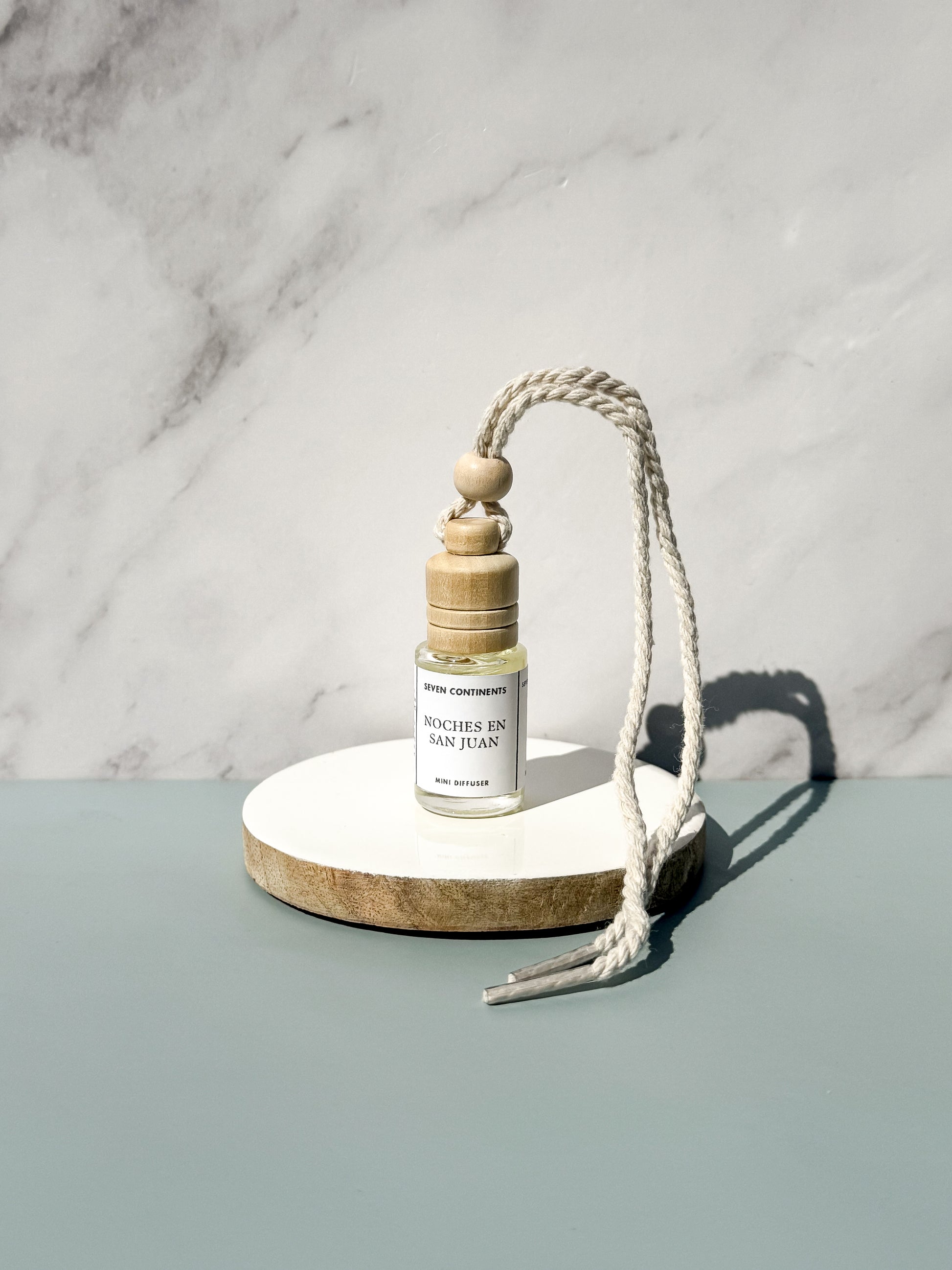 Noches en San Juan car diffuser with guava, vanilla, woods, and musk fragrance